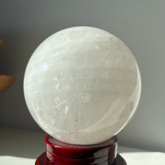 Large Milky Clear Quartz Sphere | Crystal Ball with Wispy Striped Inclusions - Picture 2 of 9